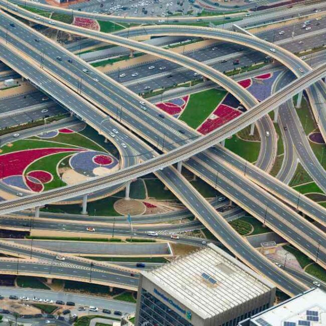 Aerial view of a complex highway interchange with landscaped areas