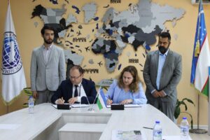 Dimitra and Dimitri Kalomallos signing the MOU for the smart city project in Uzbekistan